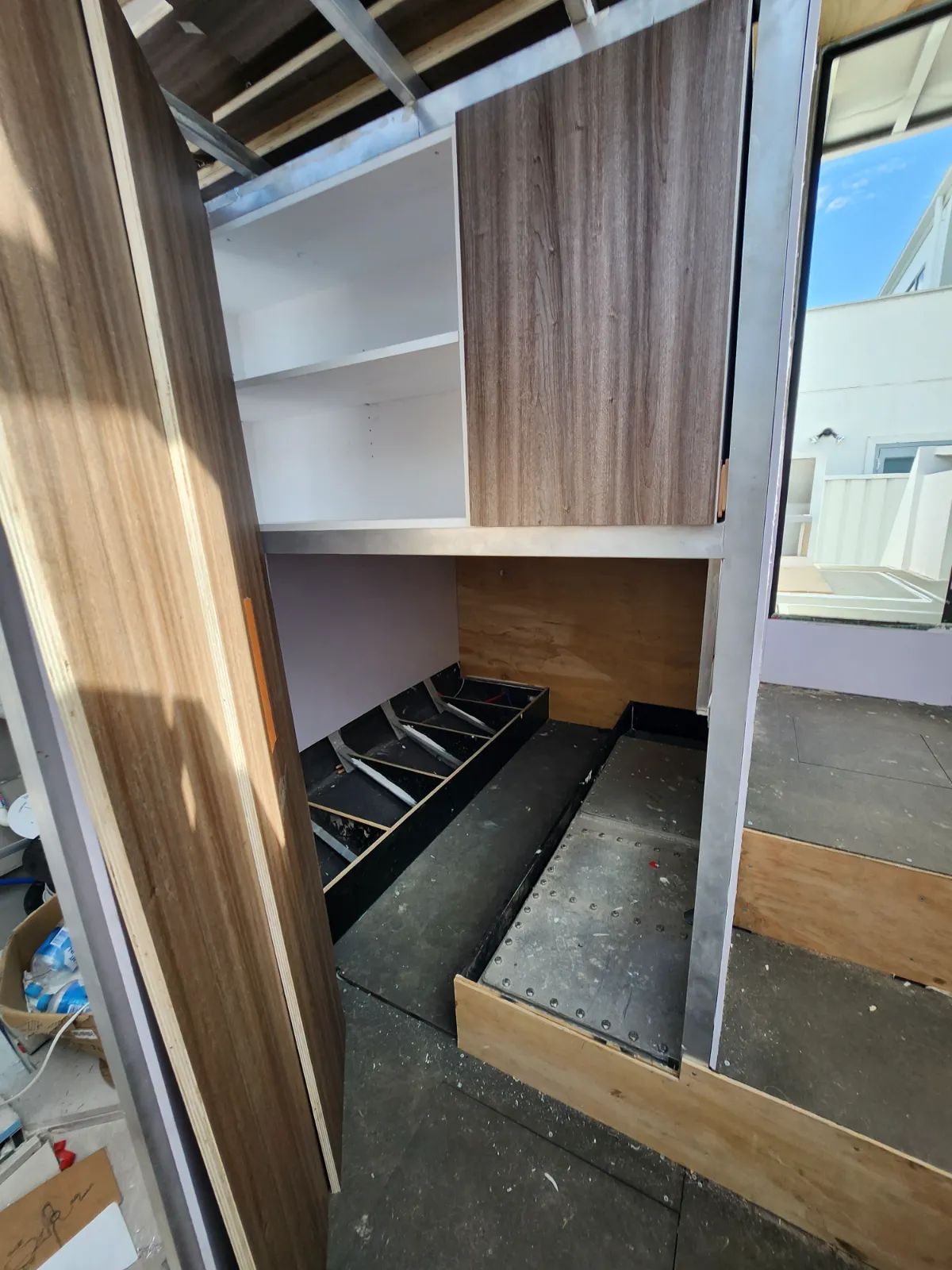 Port side cabinetry rough-in with shelving taking shape