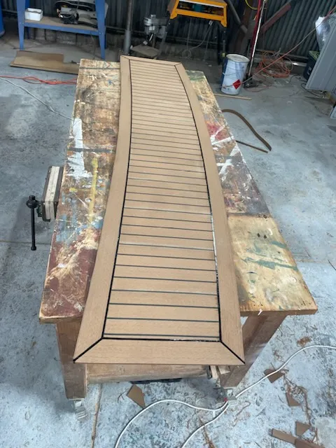 Top-Teak panel cut and laid on workshop bench ready for fitting