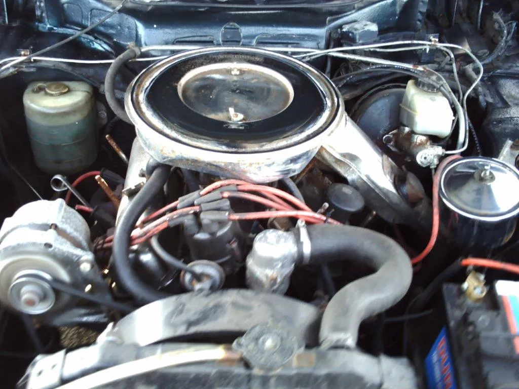 The engine bay as found, with the air filter housing, ignition leads and brake master cylinder in place