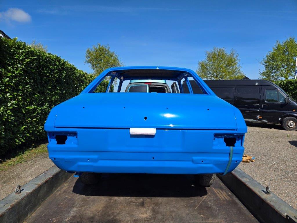 The Escort in blue paint, rear three-quarter view