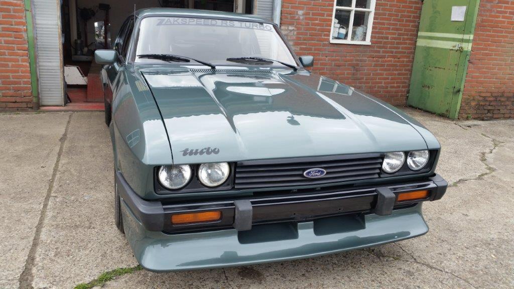 The Capri back in paint with the lights and front bumper refitted, front view