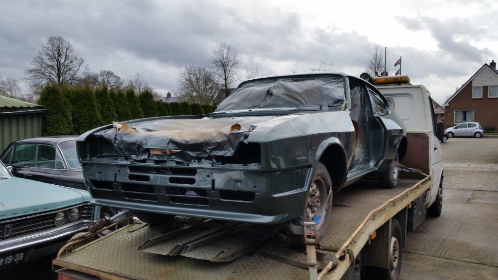 The Ford Capri 2.8 Werksturbo as found — damaged, stripped of trim and standing outside