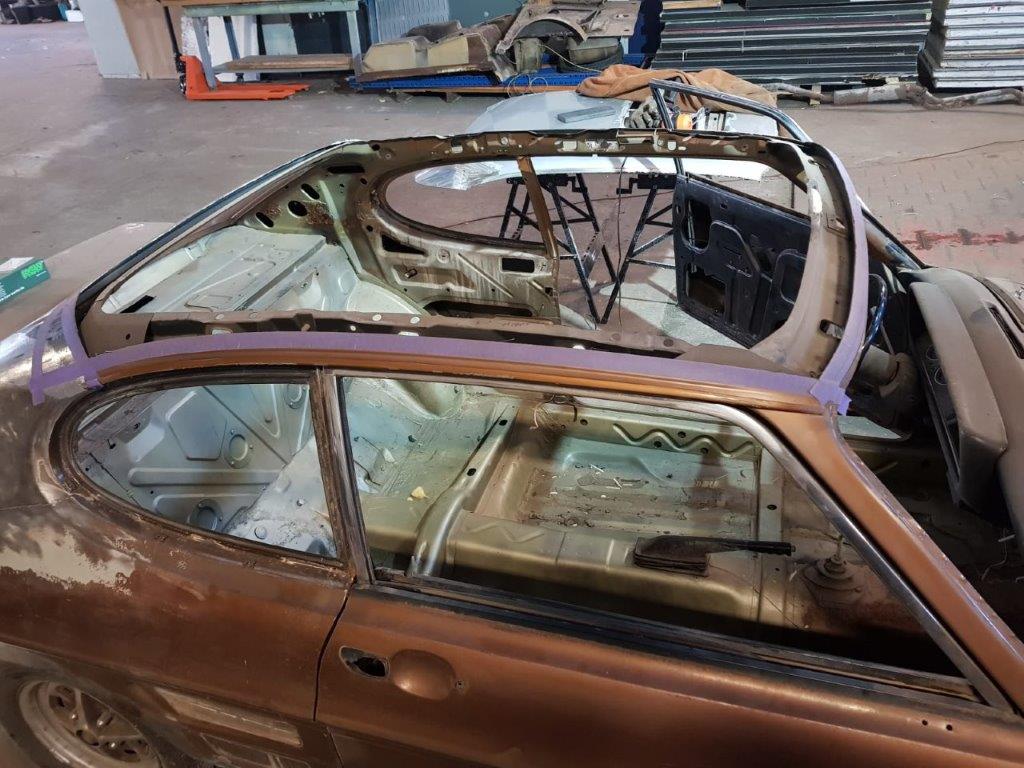 The stripped interior seen through the empty window apertures