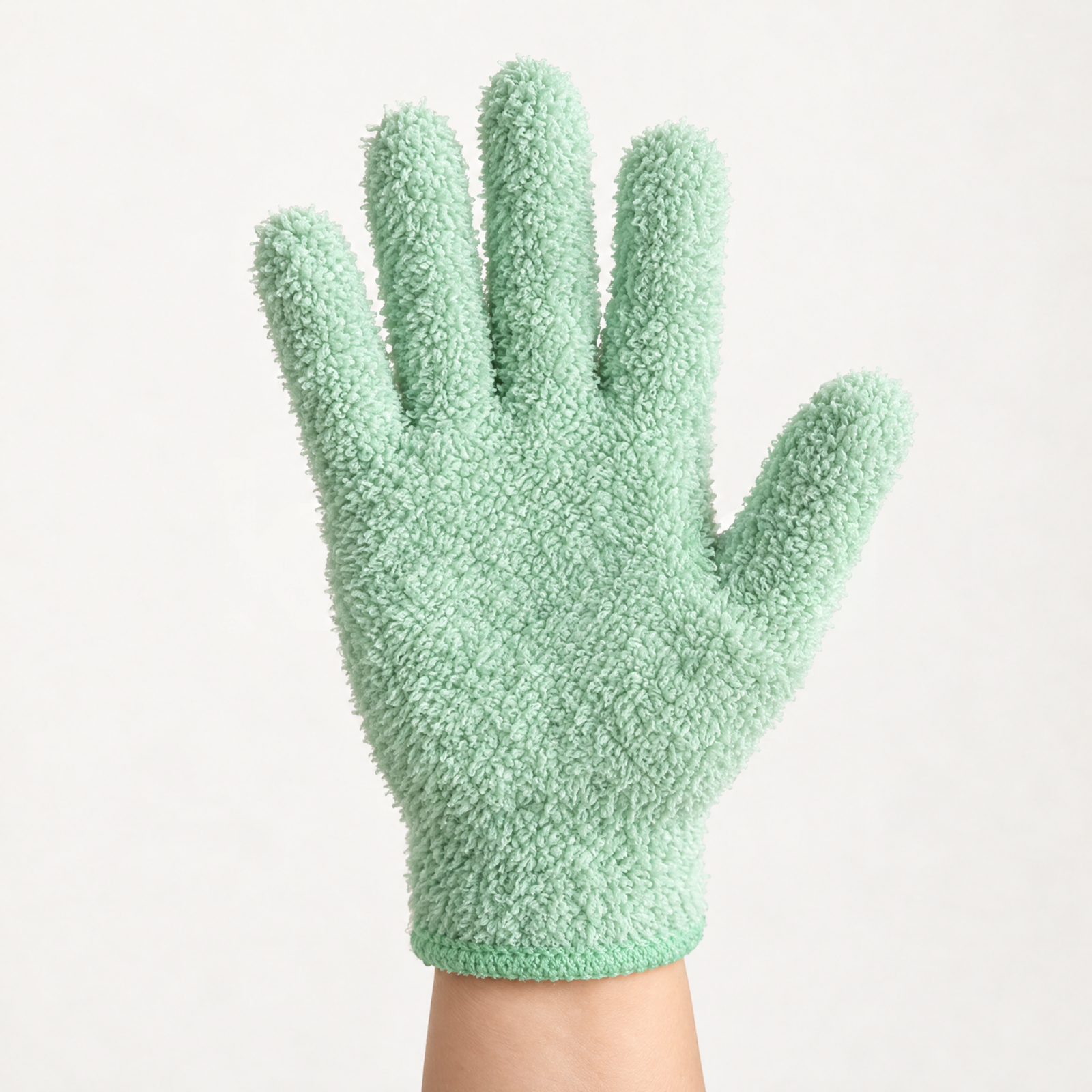 Soft green makeup-removing mitt