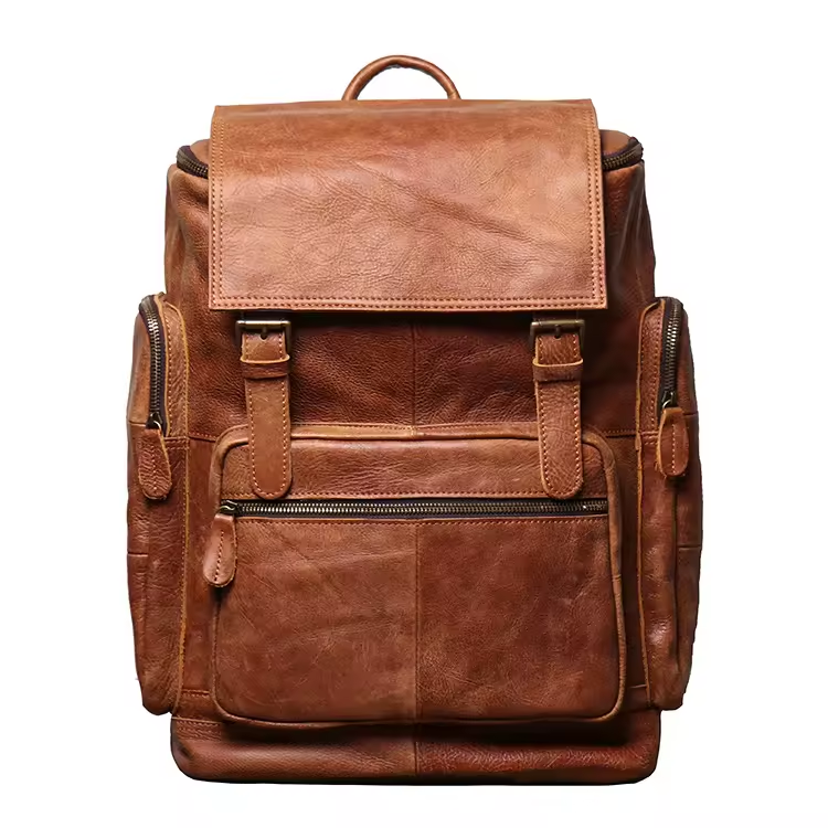 The Buckle Backpack in Brown, front view with broad flap and twin buckle straps