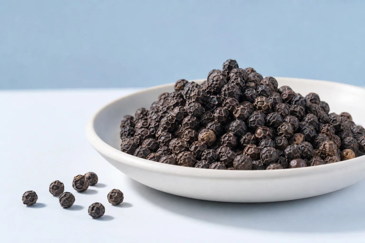Black peppercorns illustrating the botanical source of black pepper extract