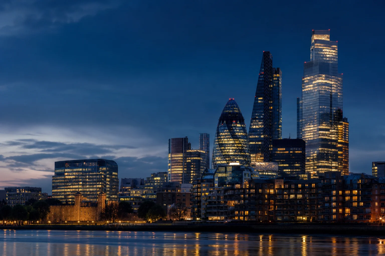 The City of London skyline at dusk, seen across the Thames