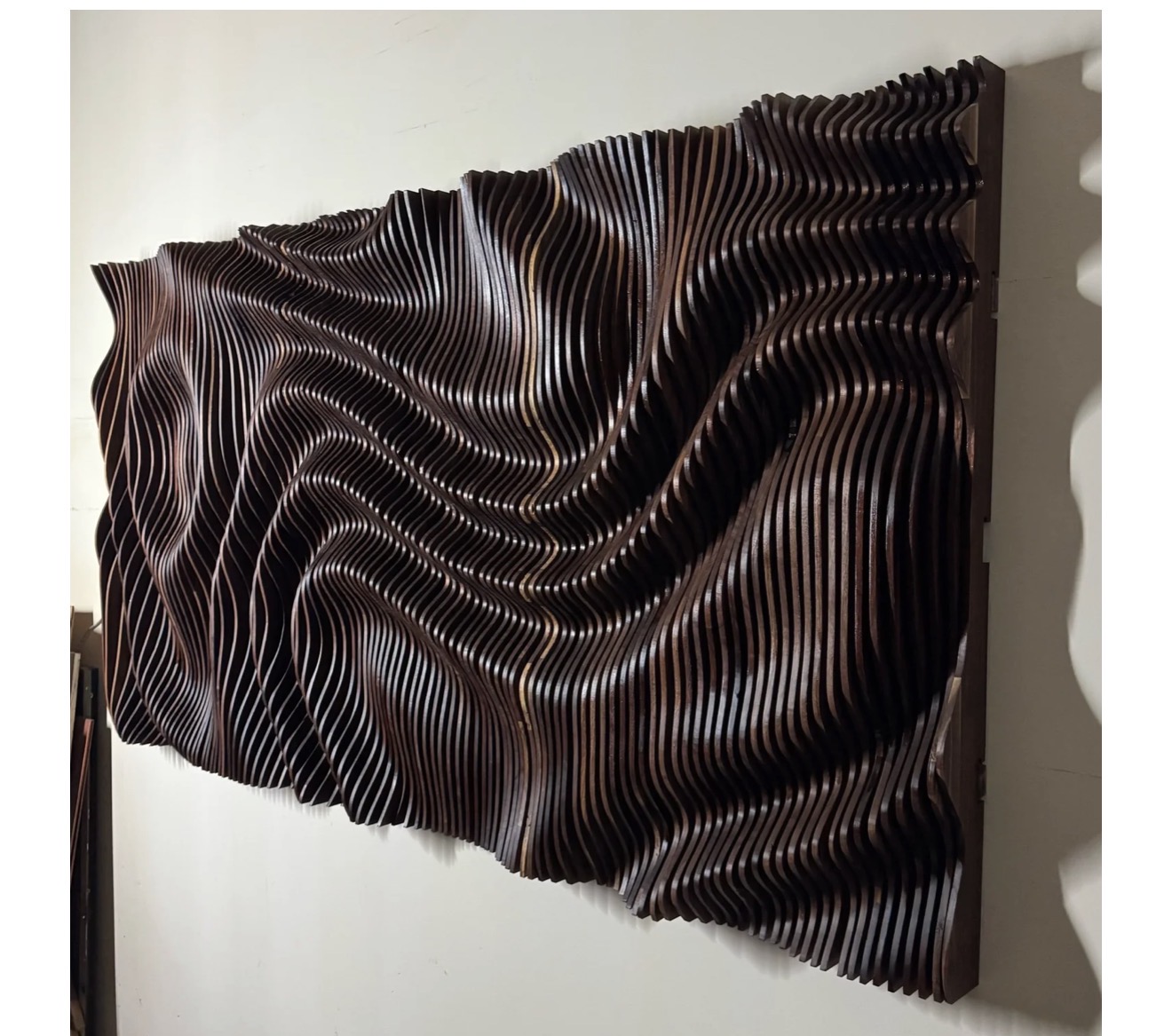 Woven Current, a sculptural live-edge walnut wall piece by Whiskey Oaks Handmade