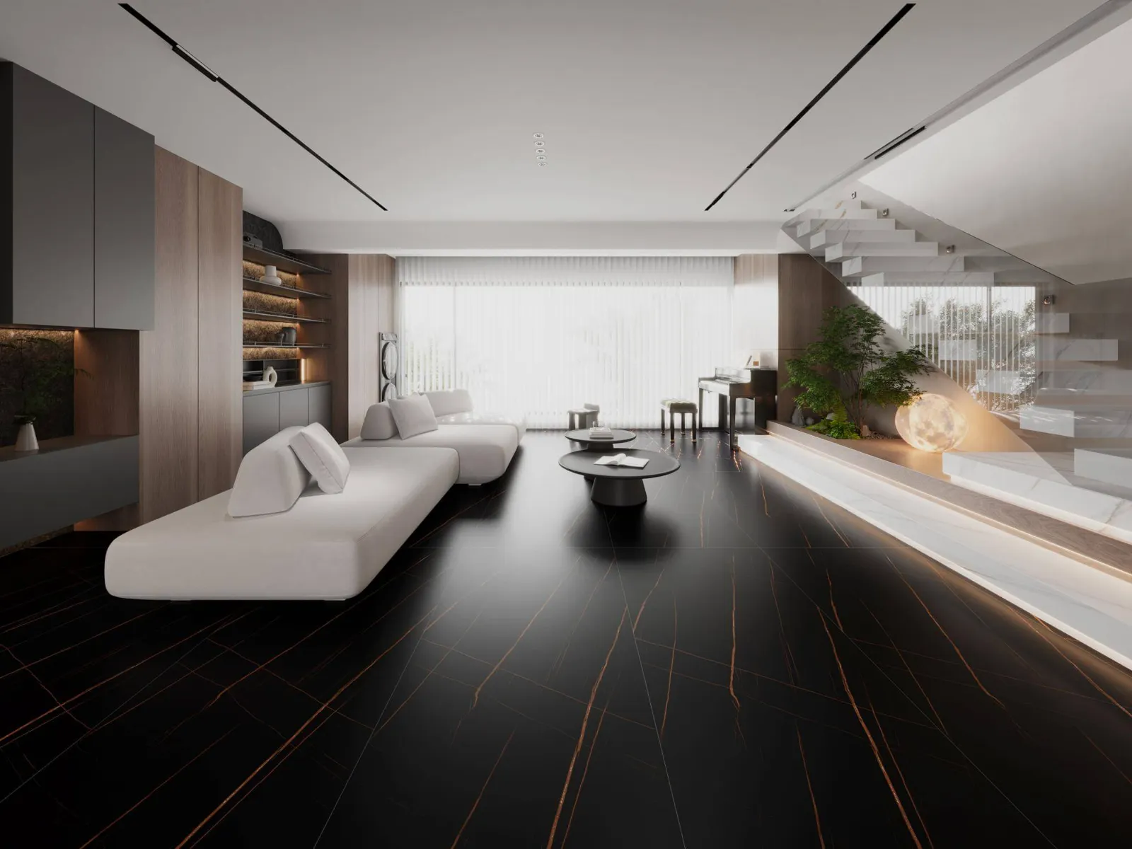 Modern living room with dark large-format flooring and warm architectural lighting