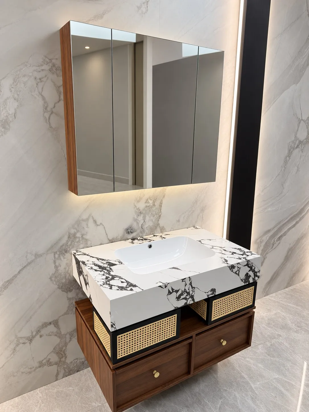 Timber and stone vanity with brass-toned detailing