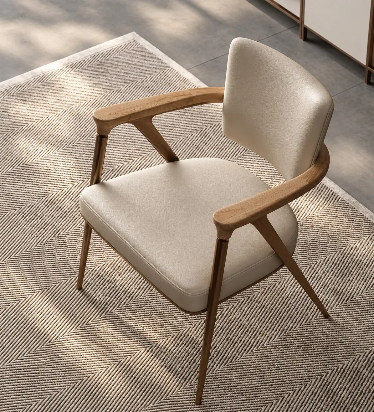 Sculpted upholstered armchair with a warm timber frame